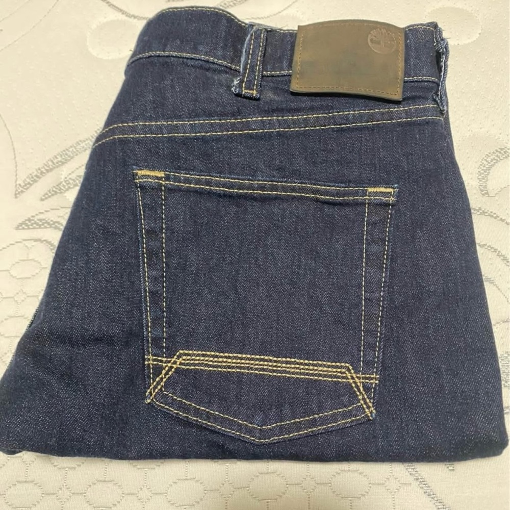 Timberland Dark Blue Denim Jeans with Contrast Stitching and Leather Patch